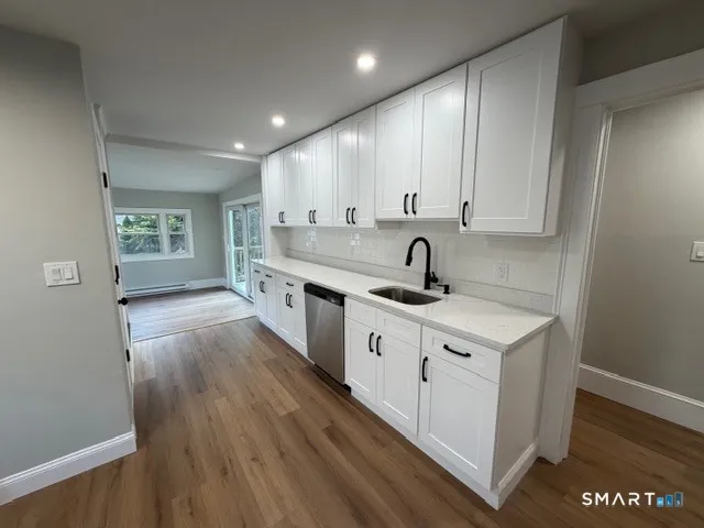 a view of a kitchen with electric appliances