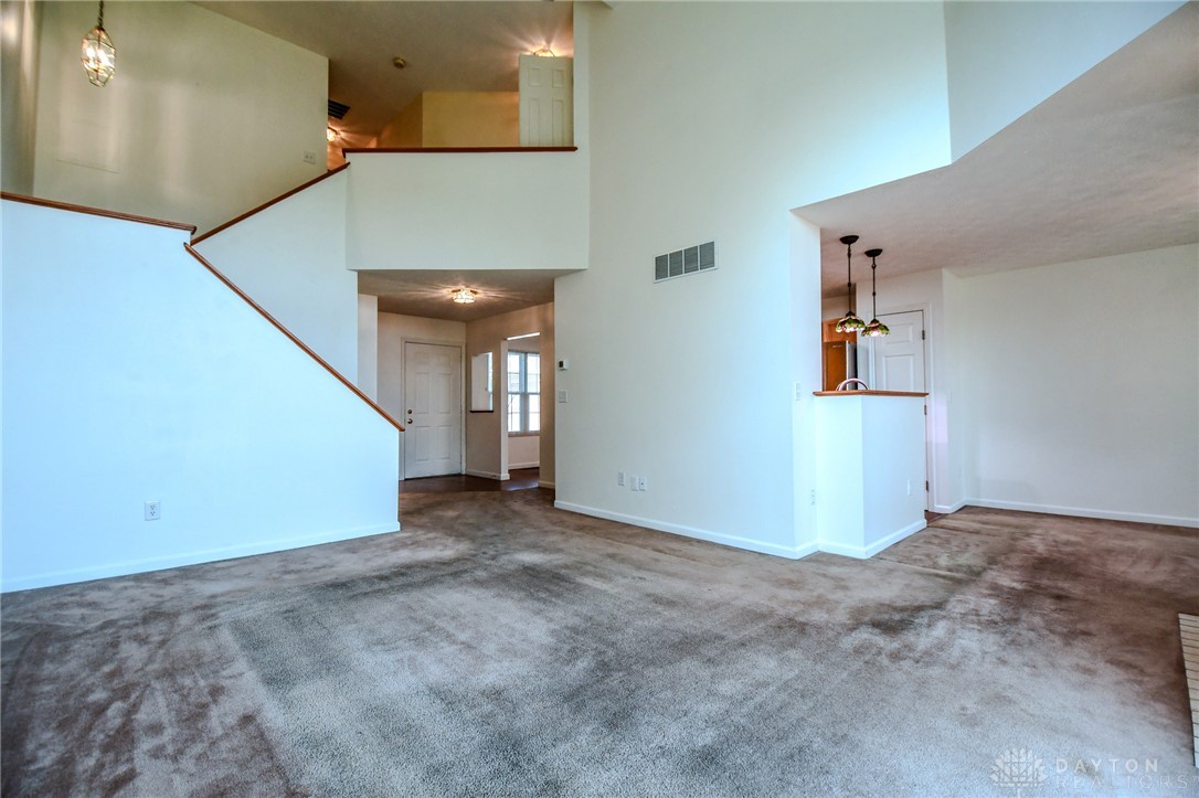 3915 East Summit Ridge Drive Beavercreek, OH 45430 - Photo 8 of 47 This living area features vaulted ceilings, inviting an abundance of natural light.