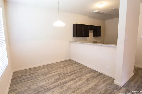 a view of a kitchen with a sink and a microwave