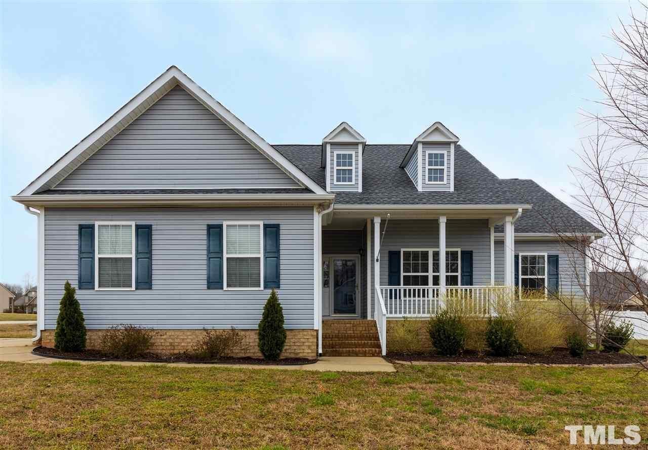 2335 Rolling Tracks Road Willow Spring, NC 27592 - Photo 24 of 24 a front view of a house with a yard