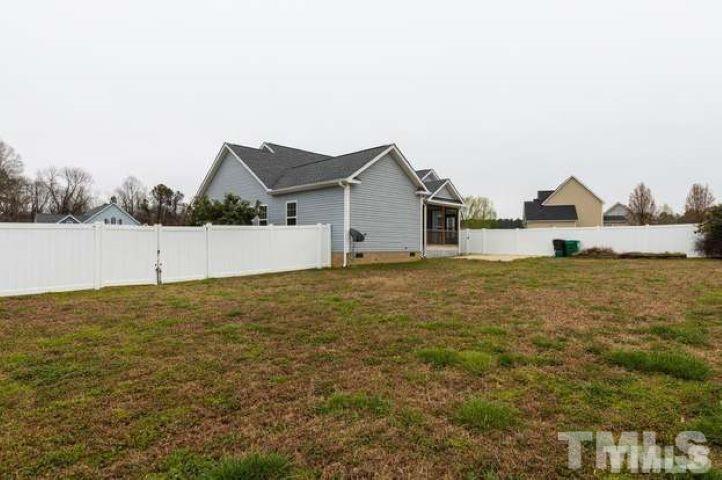 2335 Rolling Tracks Road Willow Spring, NC 27592 - Photo 1 of 24 a house view with a garden space