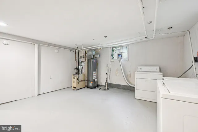 a view of storage and utility room with washer and dryer