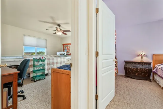 a bedroom with furniture and a chandelier