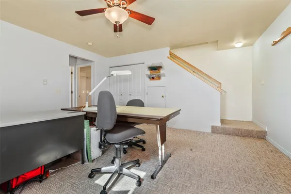 a bathroom with a sink a toilet and shower curtain