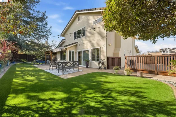 a front view of a house with garden and porch