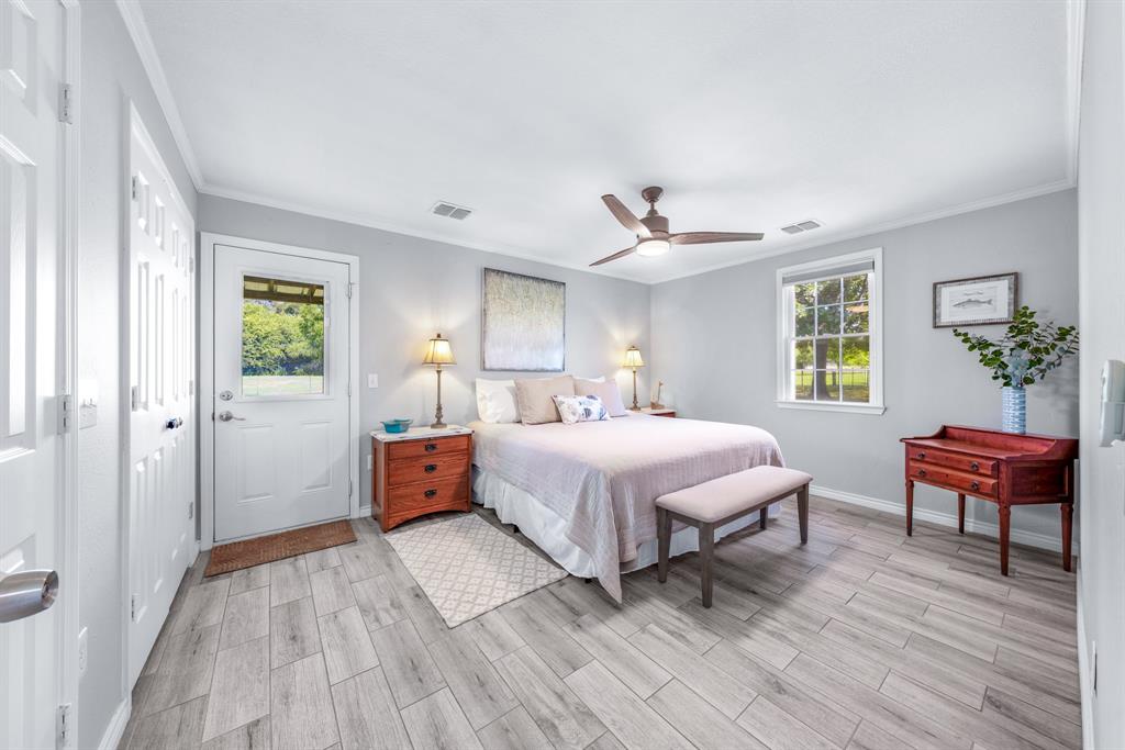 154 Wapiti Quitman, TX 75783 - Photo 11 of 24 a spacious bedroom with a bed and a chair