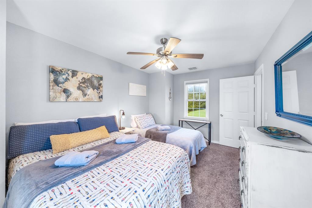 154 Wapiti Quitman, TX 75783 - Photo 19 of 24 a bedroom with a bed and a window