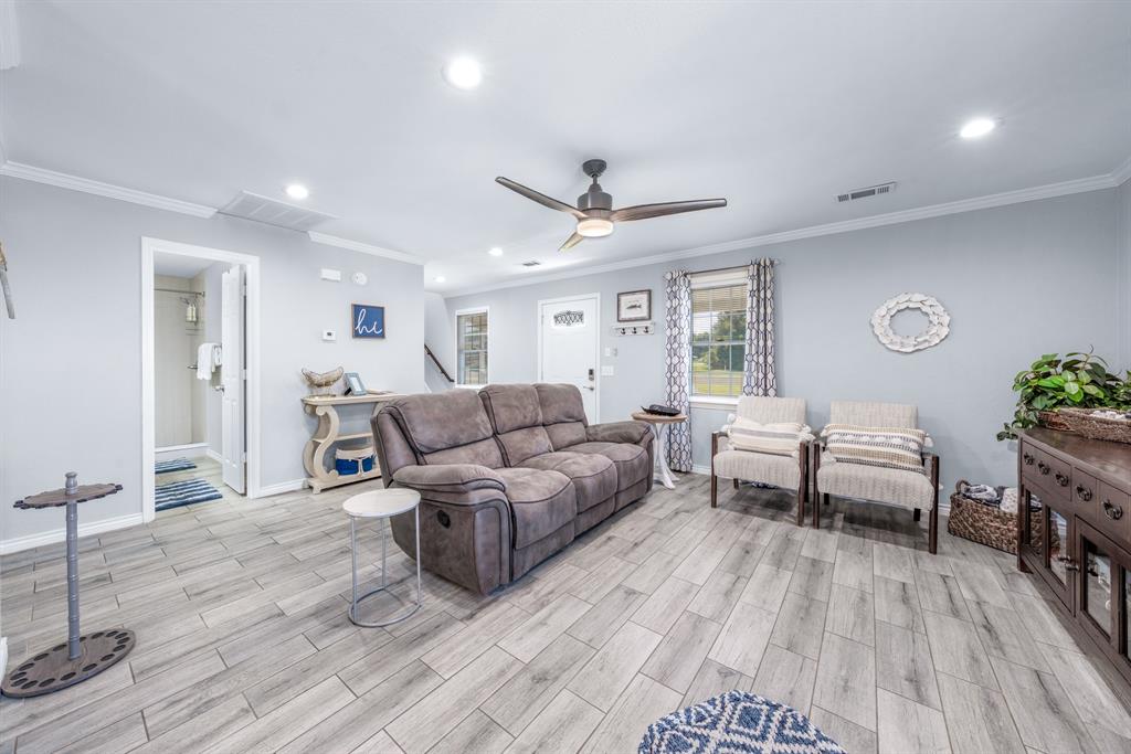 154 Wapiti Quitman, TX 75783 - Photo 6 of 24 a living room with furniture and a wooden floor