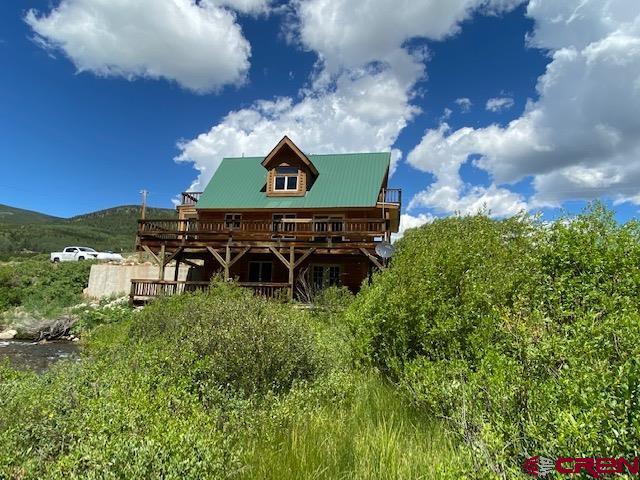 300 Quartz Lane Pitkin, CO 81241 - Photo 1 of 22 an aerial view of a house with a yard and outdoor seating