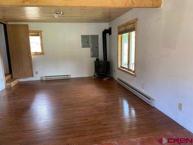 300 Quartz Lane Pitkin, CO 81241 - Photo 12 of 22 an empty room with wooden floor and windows
