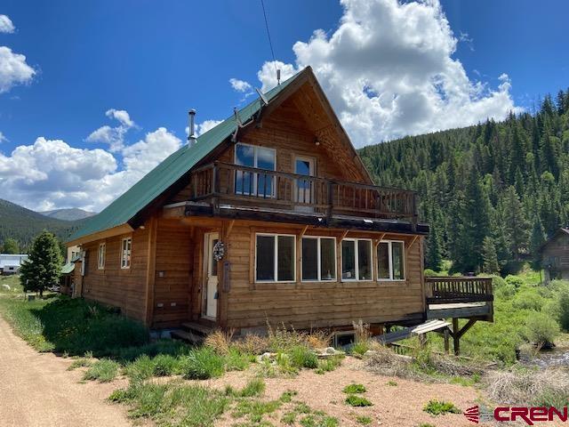 300 Quartz Lane Pitkin, CO 81241 - Photo 2 of 22 a front view of a house with garden
