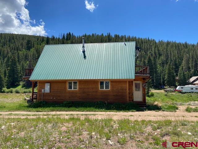 300 Quartz Lane Pitkin, CO 81241 - Photo 3 of 22 a view of a house with a garden