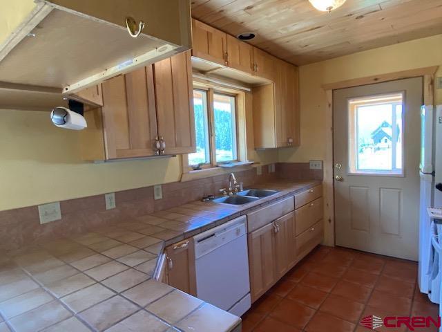 300 Quartz Lane Pitkin, CO 81241 - Photo 9 of 22 a kitchen with stainless steel appliances granite countertop a sink stove and cabinets