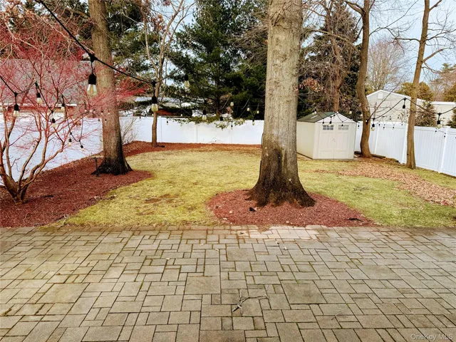 a large house with a large tree in front of it