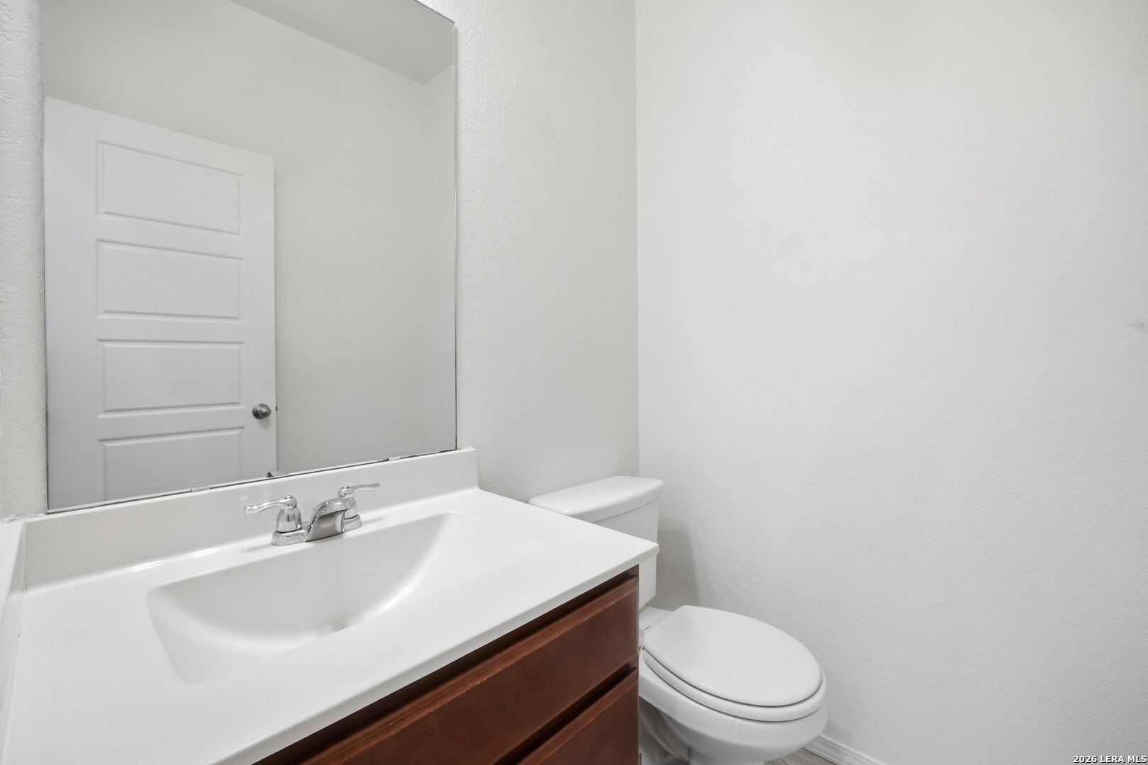 9305 Devils River Converse, TX 78109 - Photo 12 of 34 a bathroom with a sink a toilet and mirror