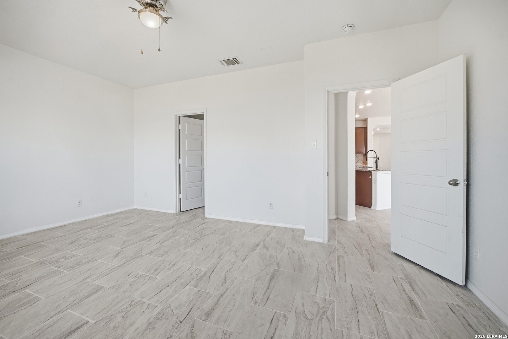 9305 Devils River Converse, TX 78109 - Photo 21 of 34 wooden floor in an empty room with a window
