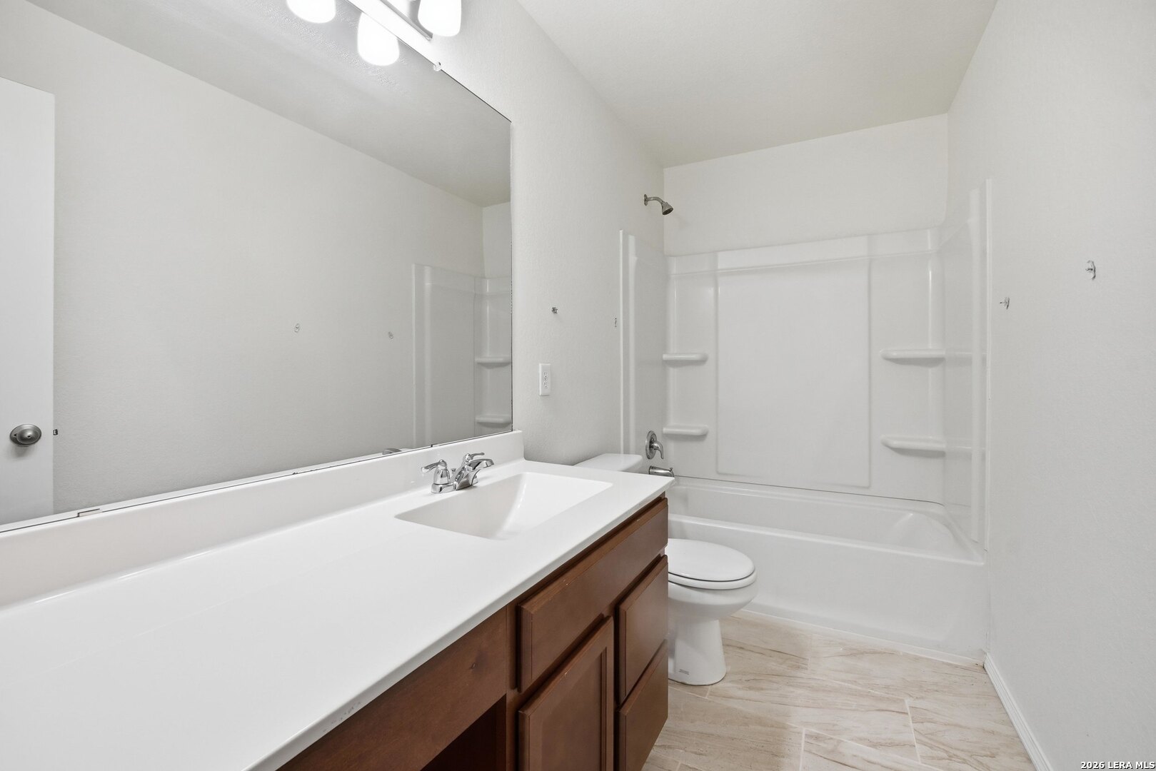 9305 Devils River Converse, TX 78109 - Photo 27 of 34 a bathroom with a sink a toilet and shower