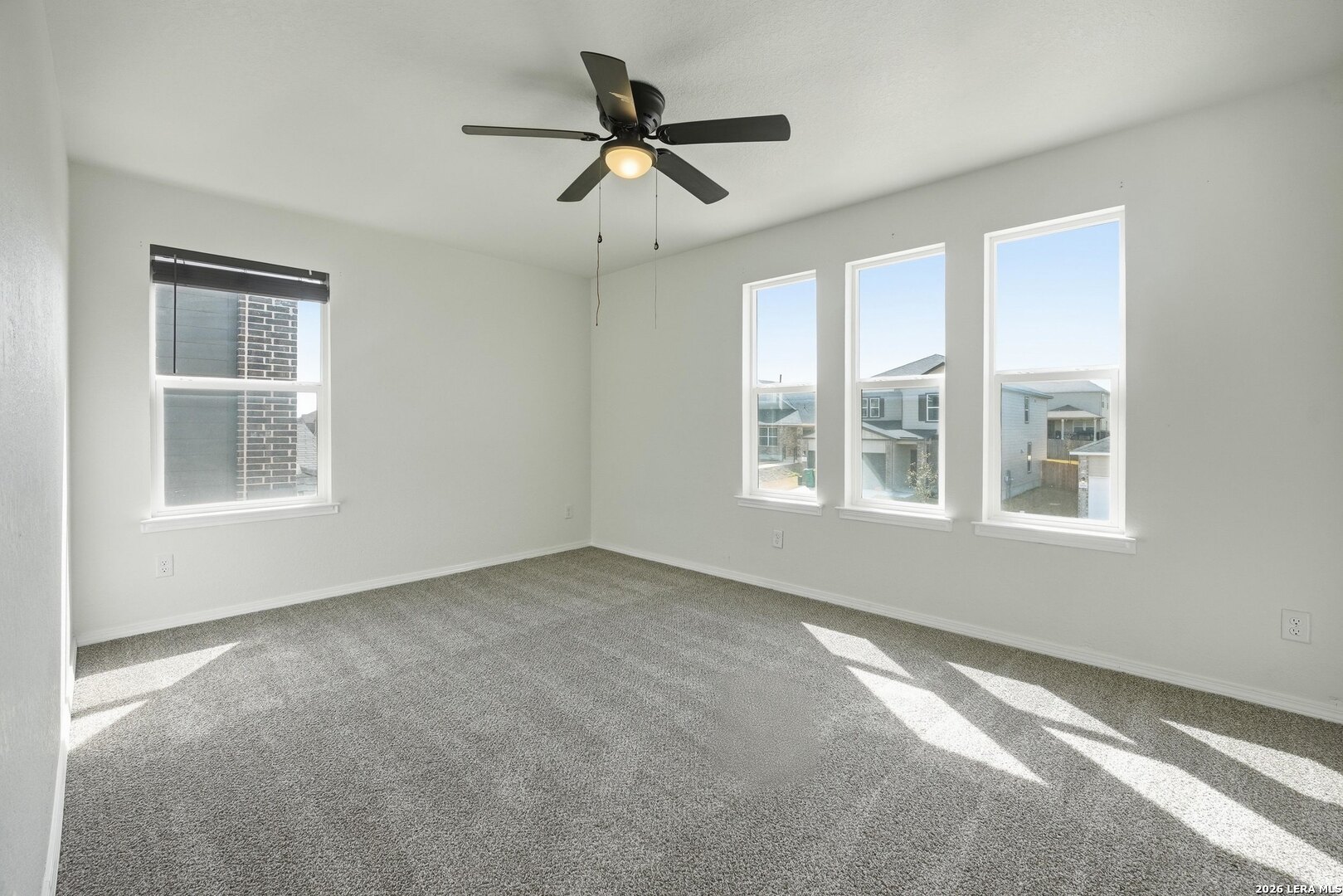 9305 Devils River Converse, TX 78109 - Photo 30 of 34 a view of a livingroom with a ceiling fan and window
