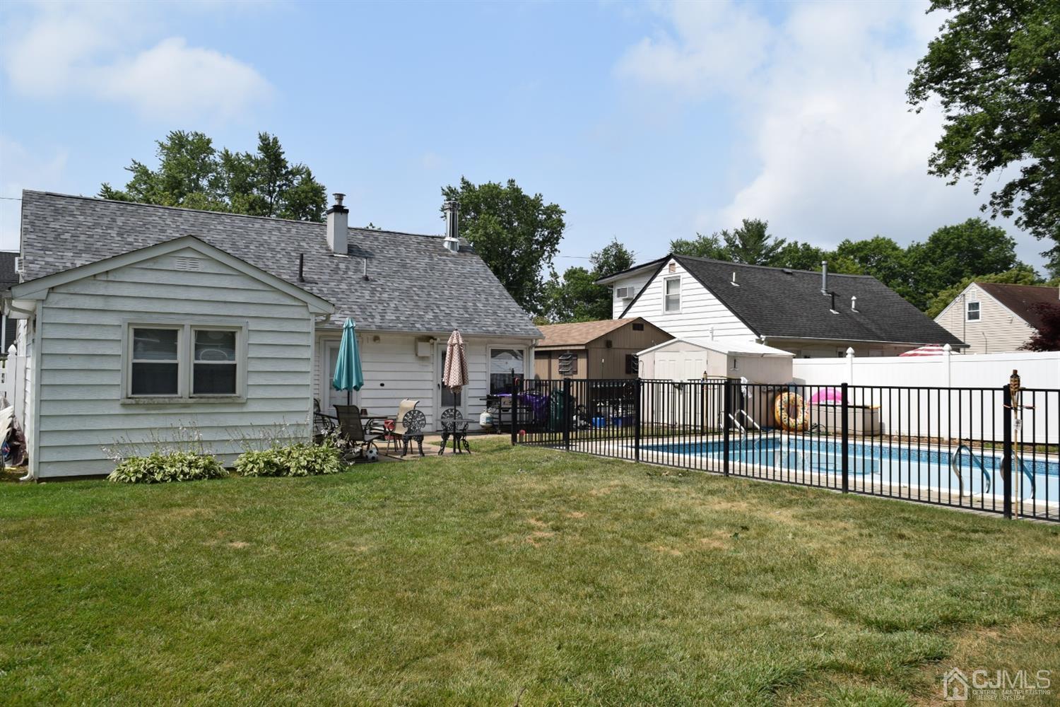 16 Parkerson Road Edison, NJ 08817 - Photo 2 of 11 a view of a house with a yard and sitting area