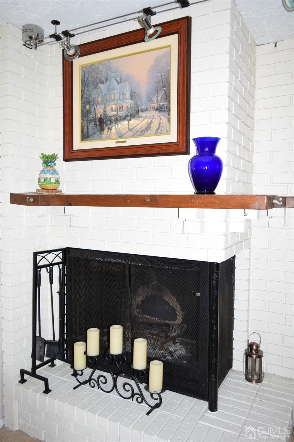 16 Parkerson Road Edison, NJ 08817 - Photo 7 of 11 a living room with furniture and a fireplace