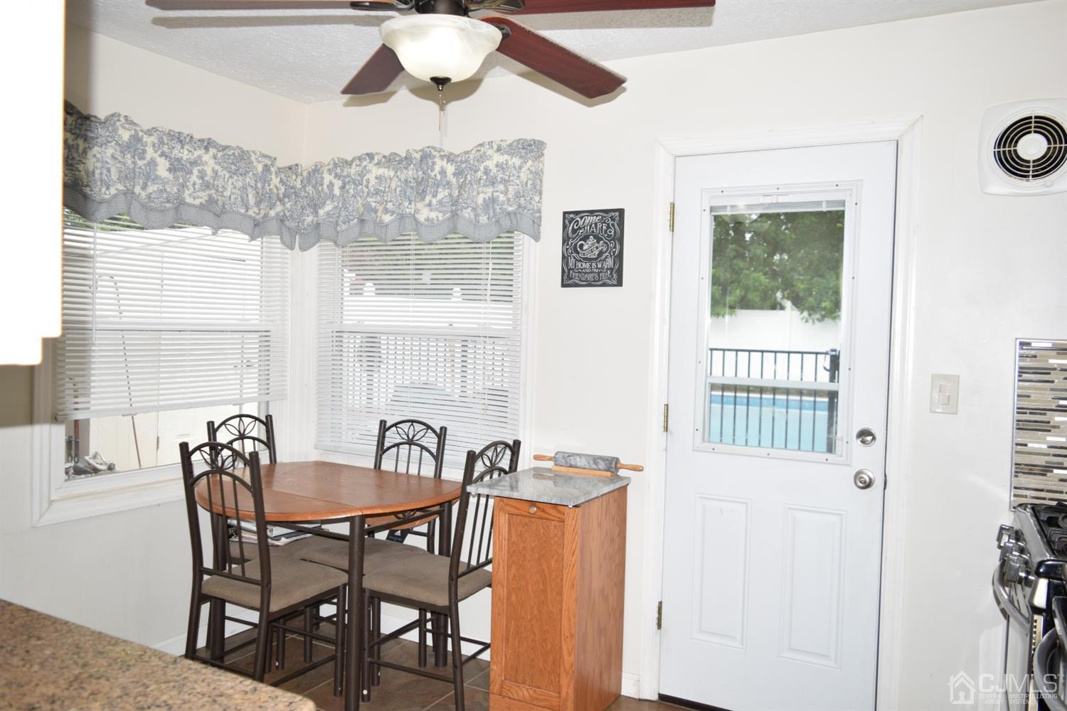 16 Parkerson Road Edison, NJ 08817 - Photo 10 of 11 a view of a dining room with furniture and window