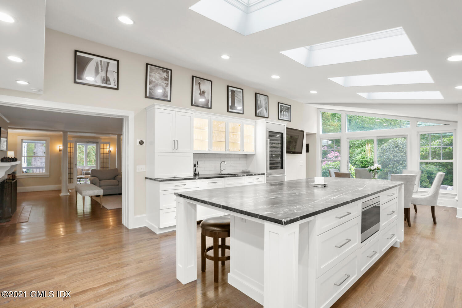 53 Hillcrest Park Road Old Greenwich, CT 06870 - Photo 13 of 53 a kitchen with stainless steel appliances granite countertop a table chairs and a wooden floor