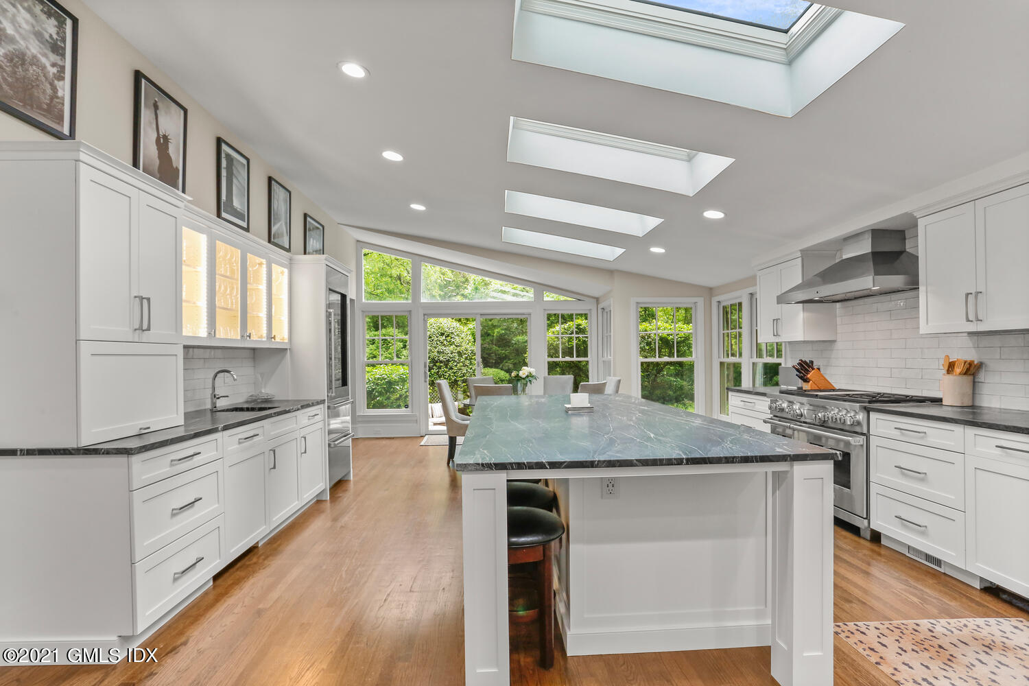 53 Hillcrest Park Road Old Greenwich, CT 06870 - Photo 14 of 53 a kitchen with stainless steel appliances granite countertop stove top oven and cabinets