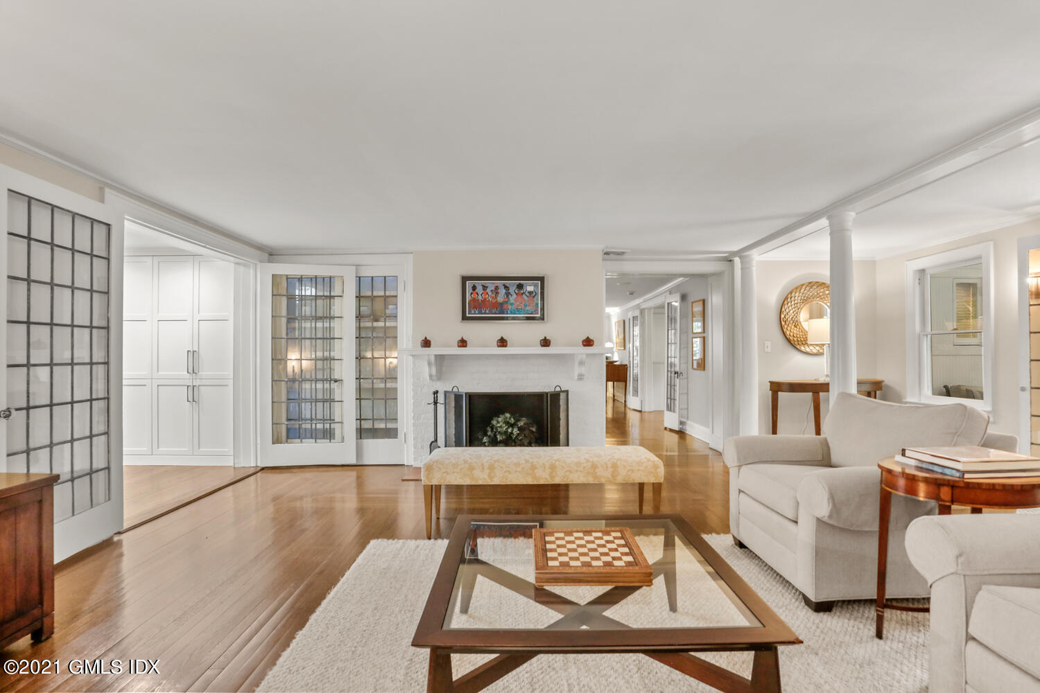 53 Hillcrest Park Road Old Greenwich, CT 06870 - Photo 19 of 53 a living room with furniture a fireplace and a flat screen tv