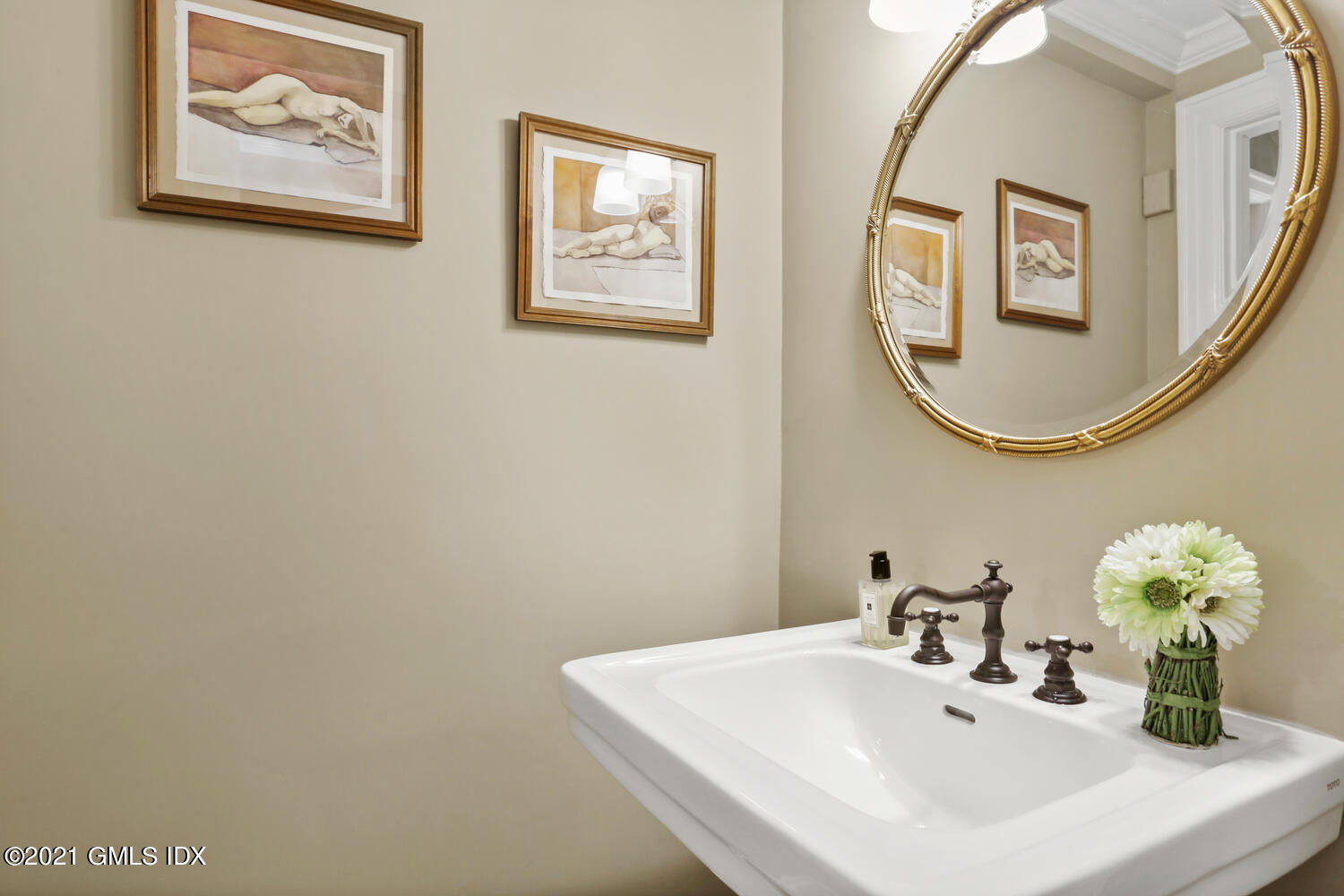 53 Hillcrest Park Road Old Greenwich, CT 06870 - Photo 21 of 53 a bathroom with a sink and a mirror