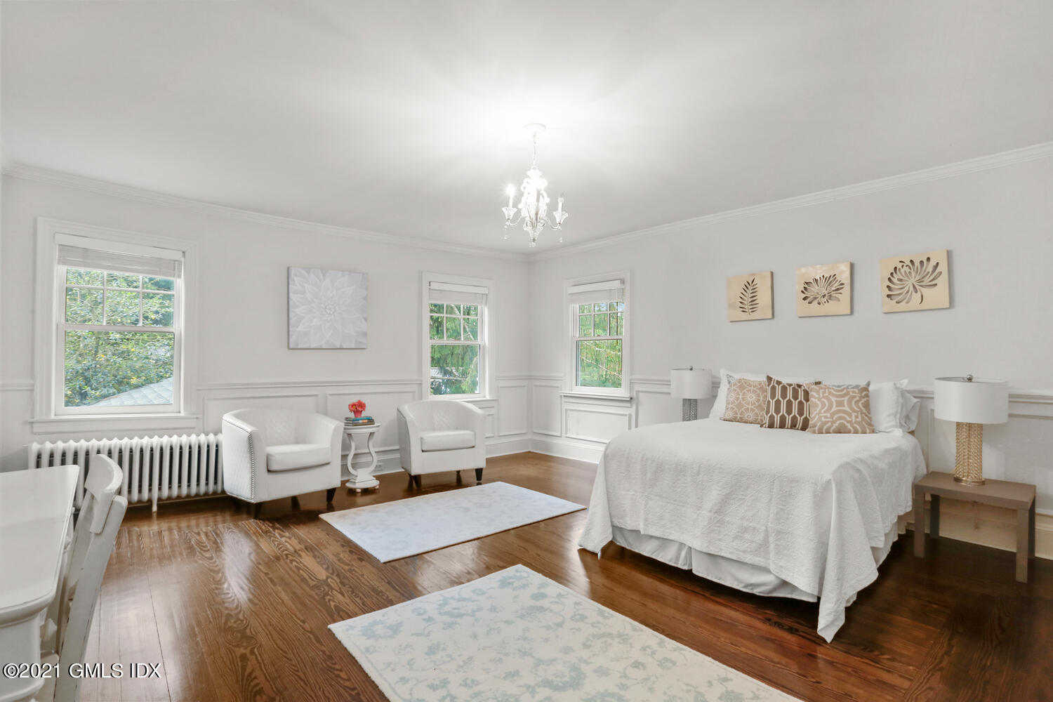 53 Hillcrest Park Road Old Greenwich, CT 06870 - Photo 28 of 53 a bedroom with a bed wooden floor and windows
