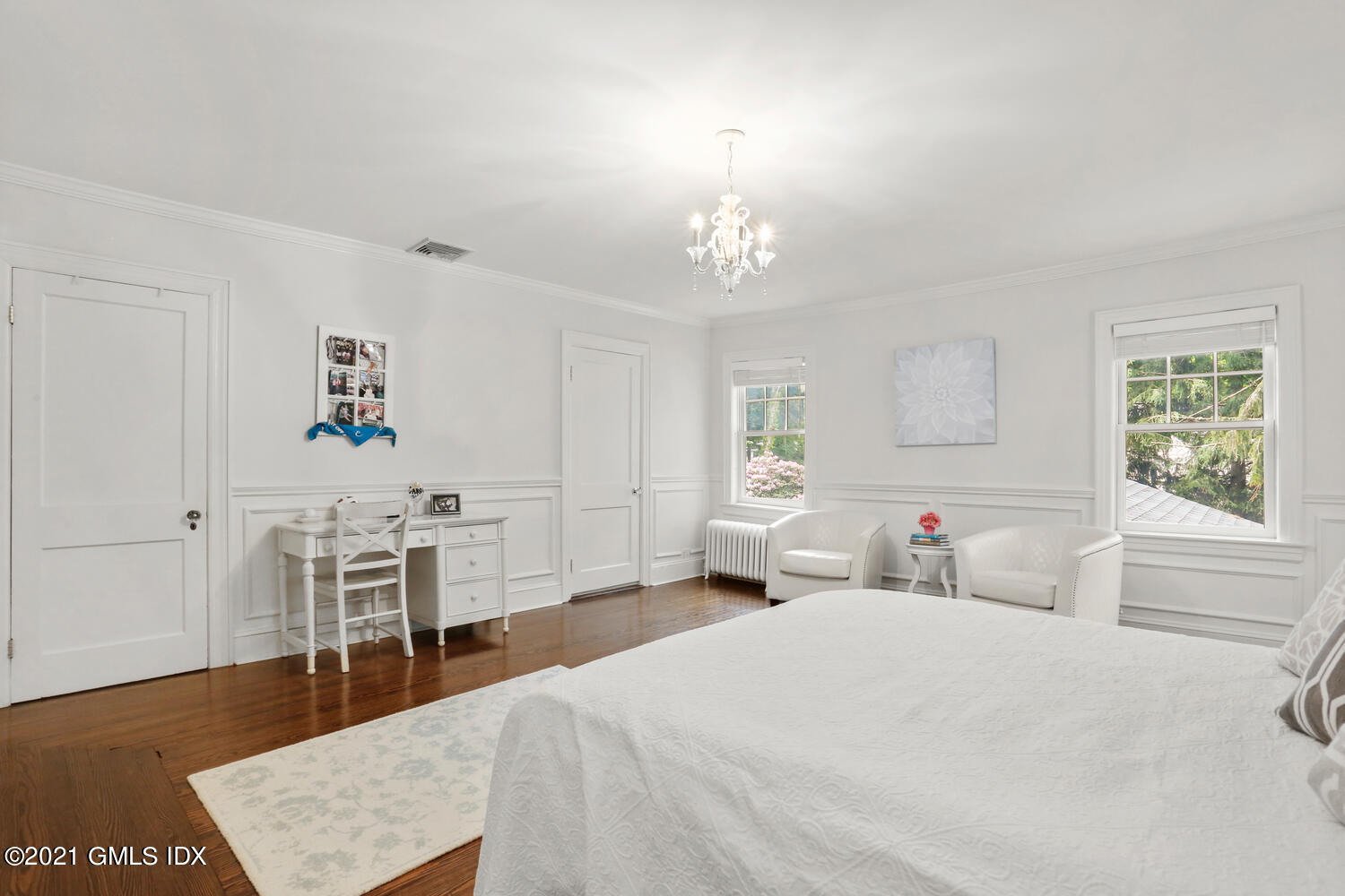 53 Hillcrest Park Road Old Greenwich, CT 06870 - Photo 29 of 53 a large bedroom with a bed and a table in it