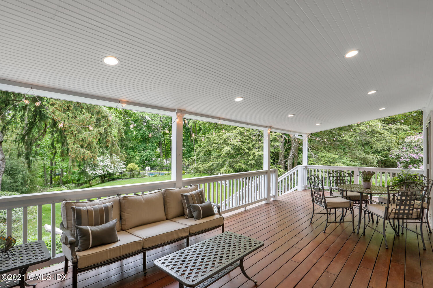 53 Hillcrest Park Road Old Greenwich, CT 06870 - Photo 40 of 53 a balcony with wooden floor outdoor seating and nature