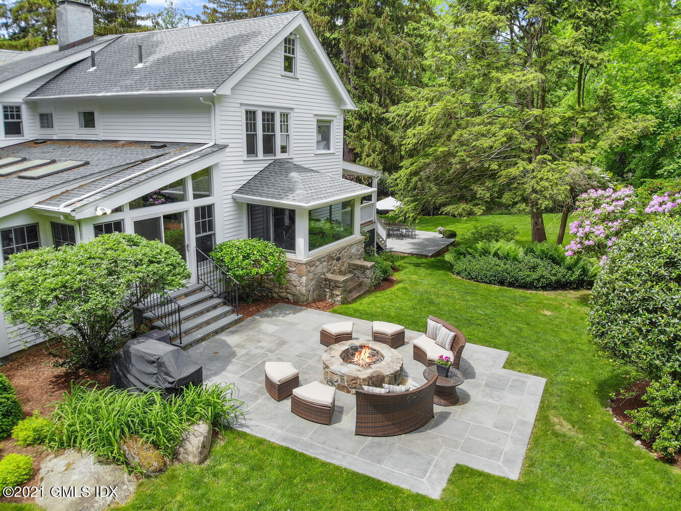 53 Hillcrest Park Road Old Greenwich, CT 06870 - Photo 41 of 53 a front view of a house with a yard