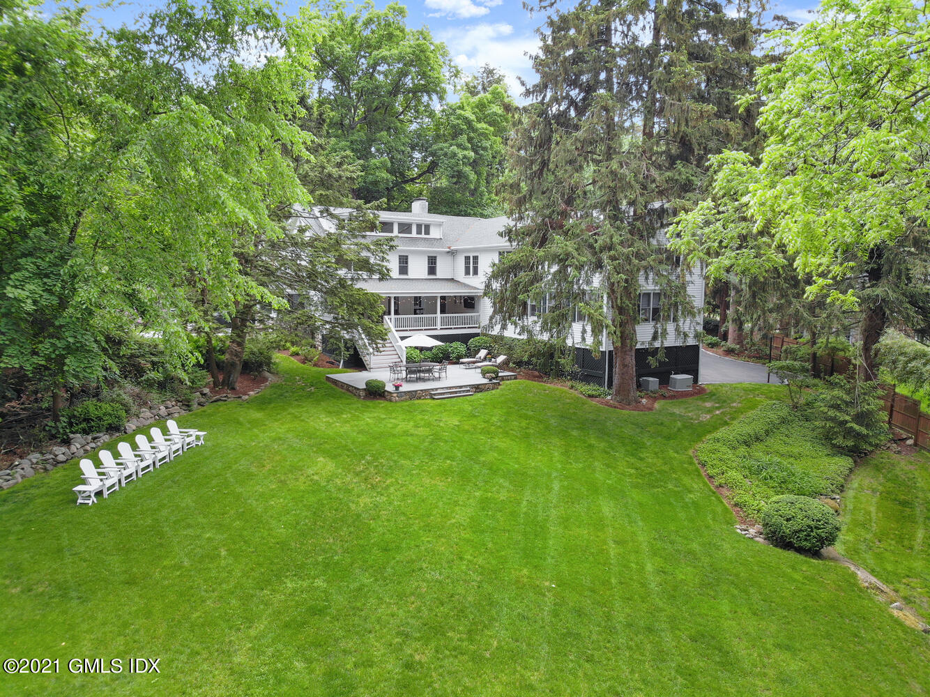 53 Hillcrest Park Road Old Greenwich, CT 06870 - Photo 46 of 53 a view of a house with a yard porch and sitting area