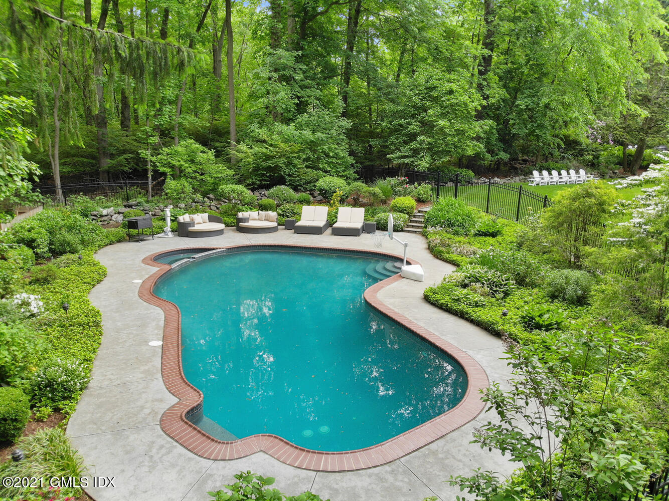 53 Hillcrest Park Road Old Greenwich, CT 06870 - Photo 47 of 53 a view of a swimming pool with a yard