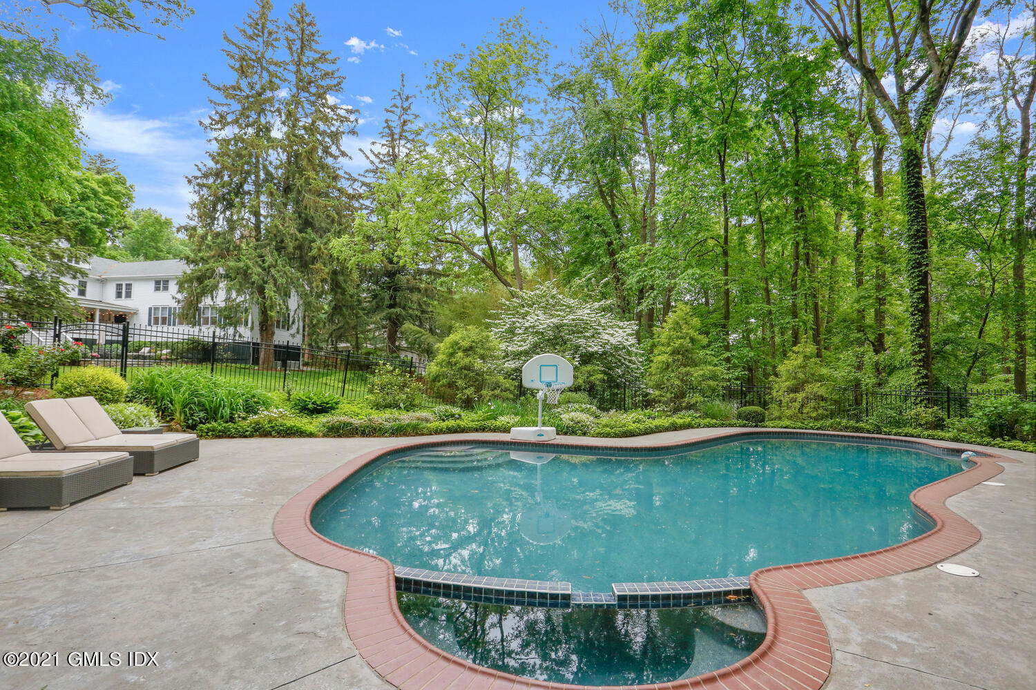 53 Hillcrest Park Road Old Greenwich, CT 06870 - Photo 48 of 53 a view of a swimming pool with a patio