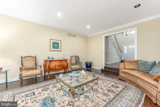 a living room with furniture and a rug