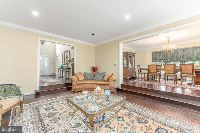 a bedroom with a bed a table and chair