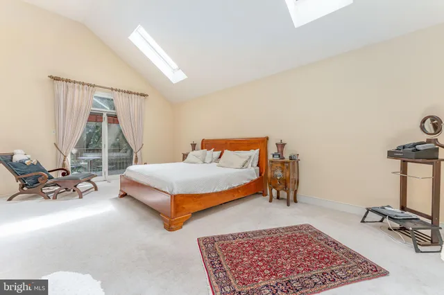 a bedroom with furniture and flat screen tv