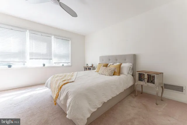 a spacious bathroom with a double vanity sink and a mirror