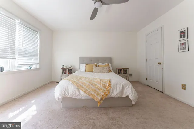 a spacious bathroom with a double vanity sink a mirror and a bathtub
