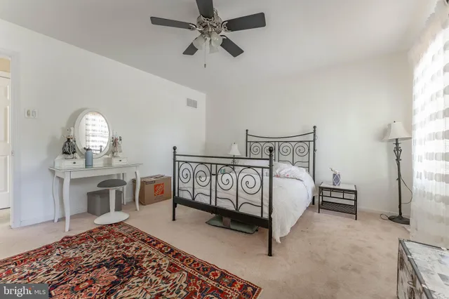 a living room with stainless steel appliances kitchen island granite countertop a sink and cabinets