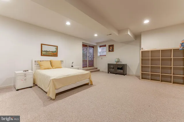 a view of backyard with outdoor seating and trees