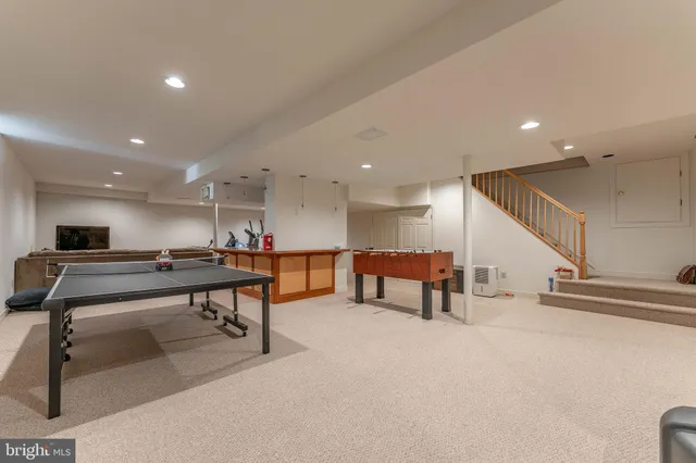 a view of green field with trees in the background