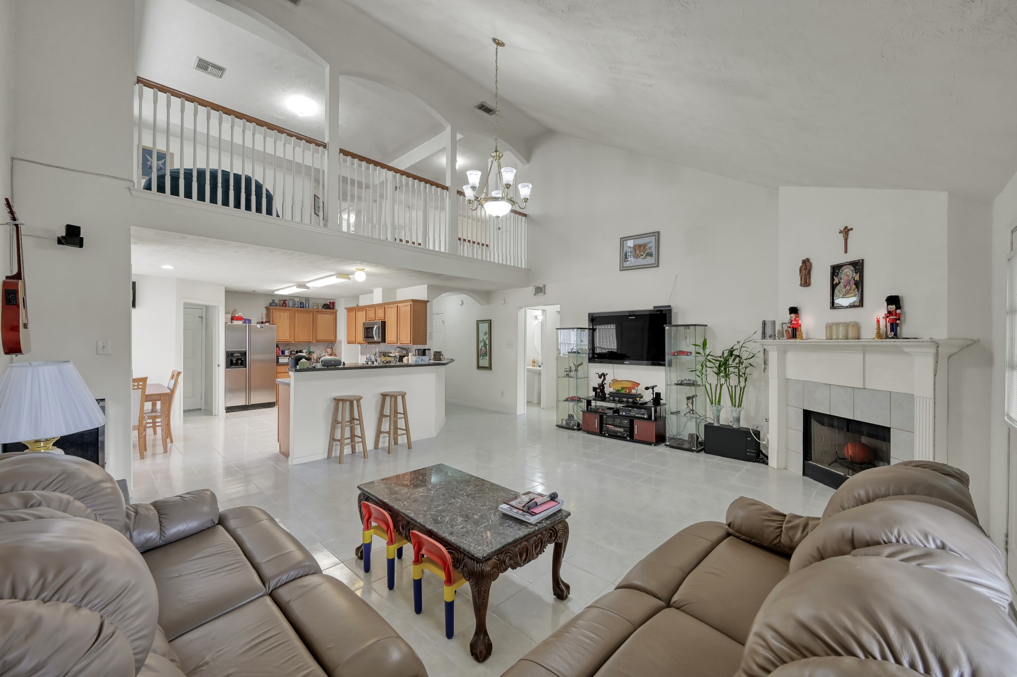 2539 Forge Creek Road Houston, TX 77067 - Photo 15 of 40 Open-to-below design gives the living room soaring ceilings.