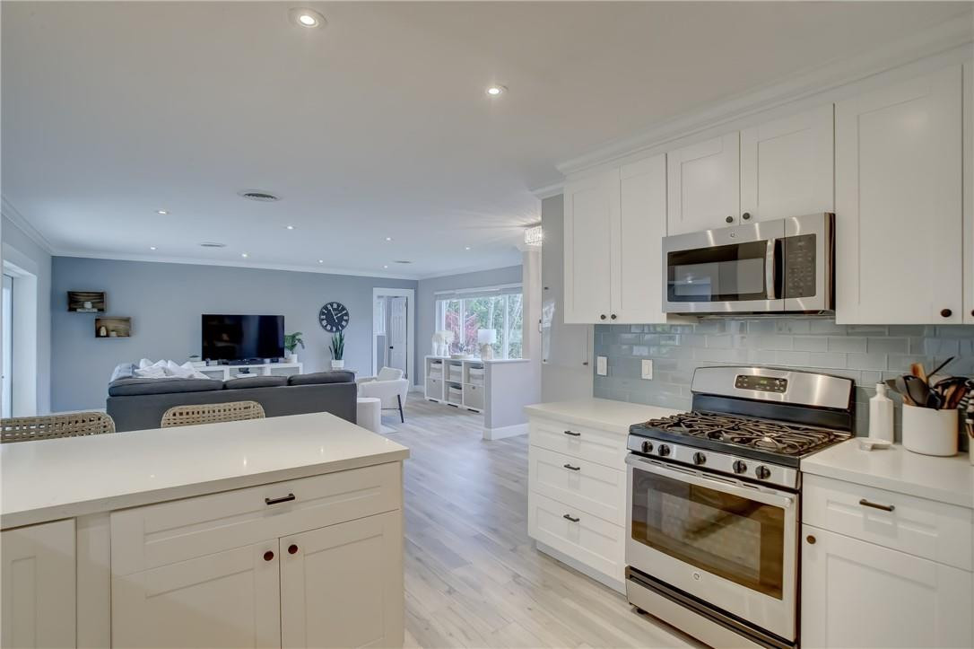 4117 McKinley Street Hollywood, FL 33021 - Photo 16 of 52 a kitchen with a stove and a microwave