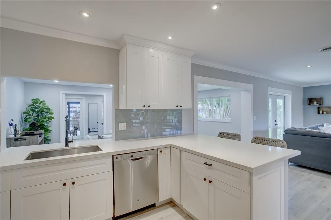 4117 McKinley Street Hollywood, FL 33021 - Photo 17 of 52 a kitchen with a sink cabinets and window