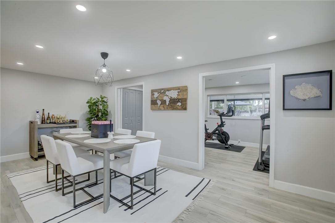 4117 McKinley Street Hollywood, FL 33021 - Photo 19 of 52 a view of a dining room with furniture and wooden floor