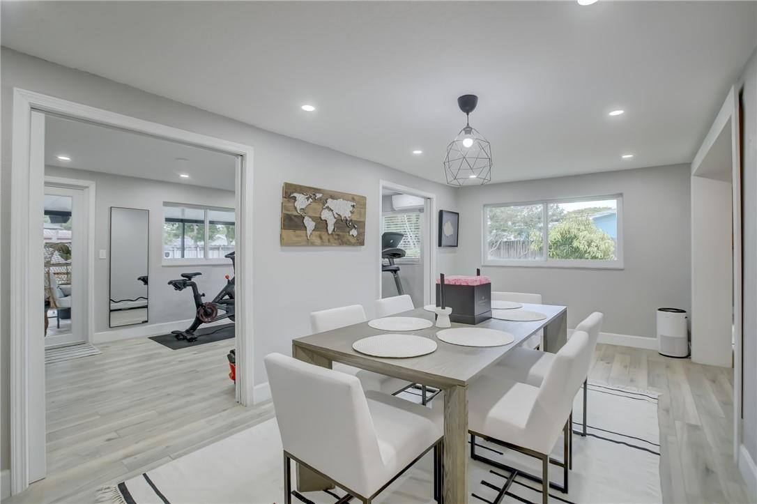 4117 McKinley Street Hollywood, FL 33021 - Photo 20 of 52 a view of a dining room with furniture window and wooden floor