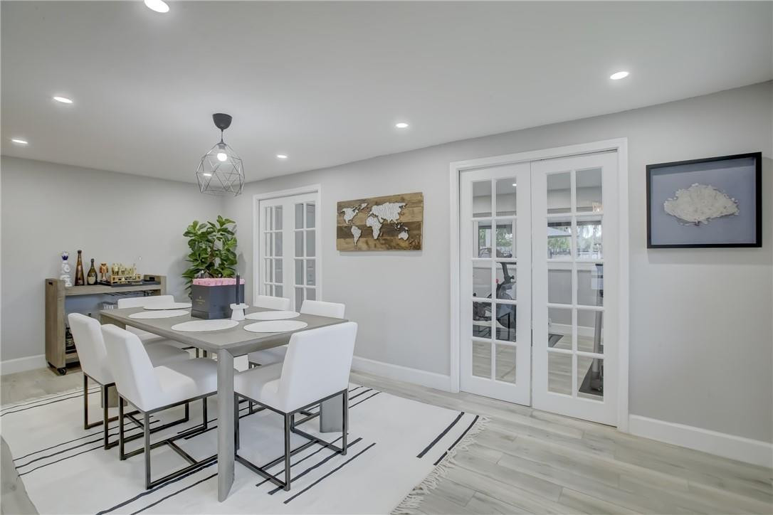 4117 McKinley Street Hollywood, FL 33021 - Photo 23 of 52 a view of a dining room with furniture and wooden floor
